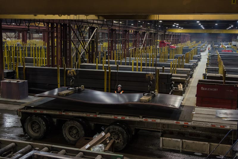 several people working together to build a wood frame